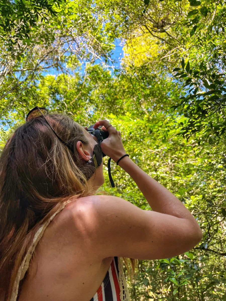 woman taking photo Punta Laguna